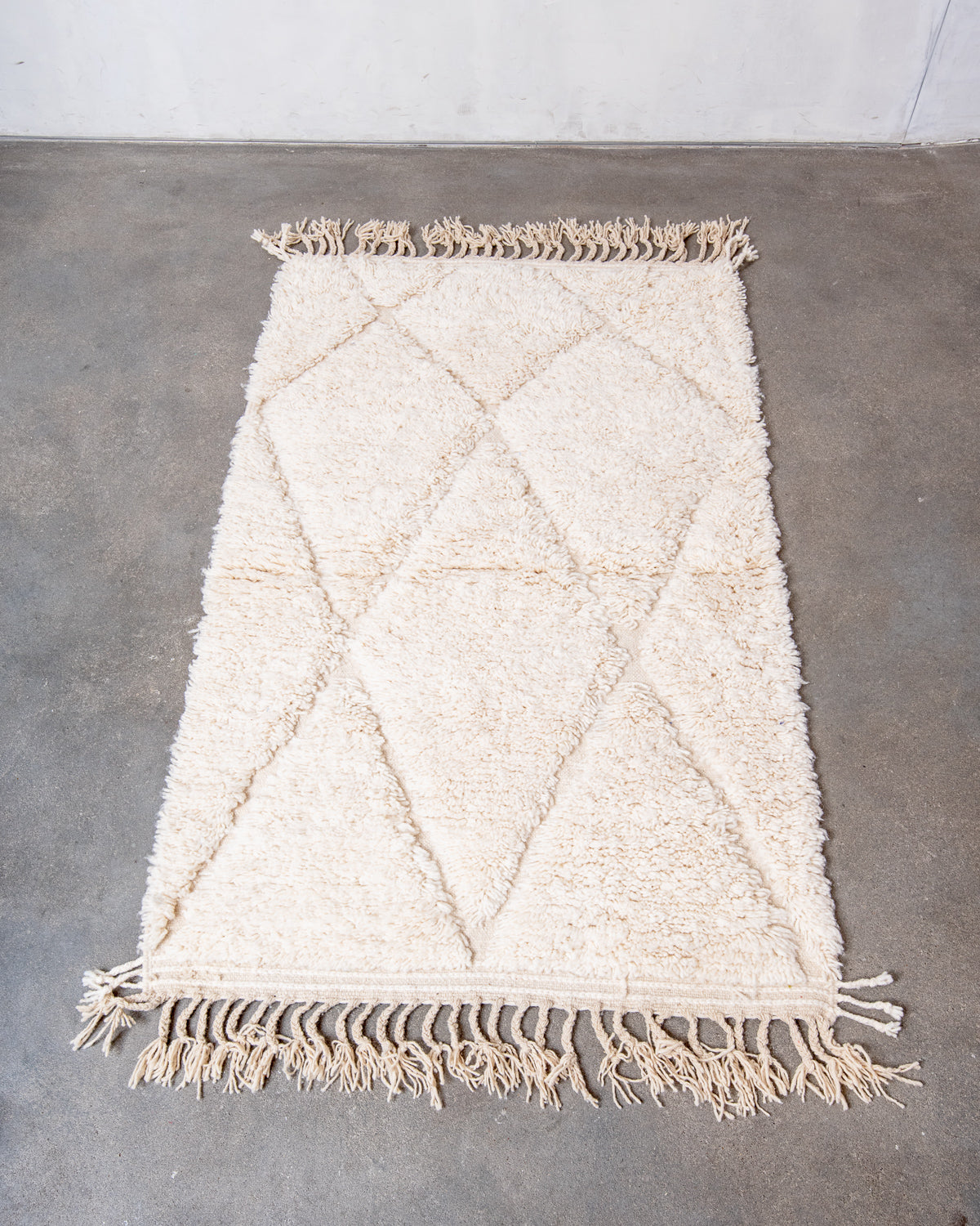 Modern, designer, handcrafted Berber rug from Morocco. Beniourain carpet with minimalist design, natural wool pile and a fluffy texture.